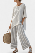 Fiorella – blusa asimétrica elegante y pantalones a rayas