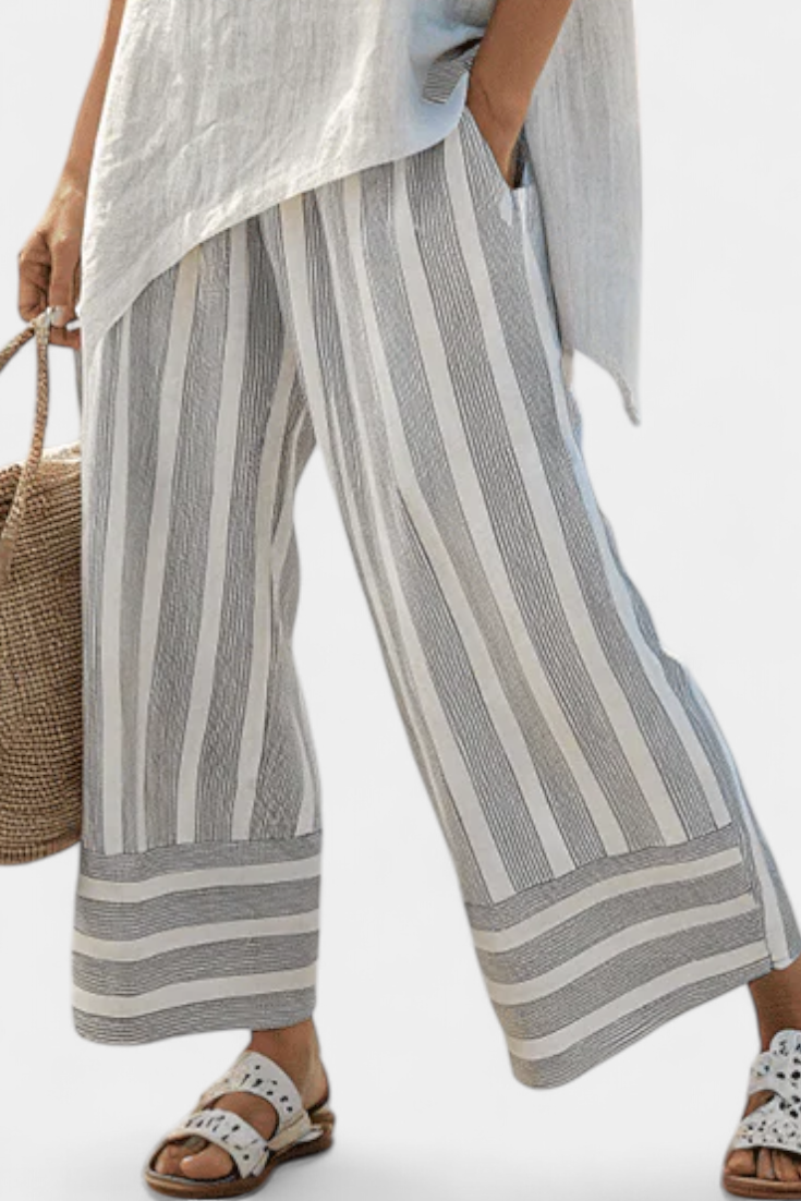 Fiorella – blusa asimétrica elegante y pantalones a rayas